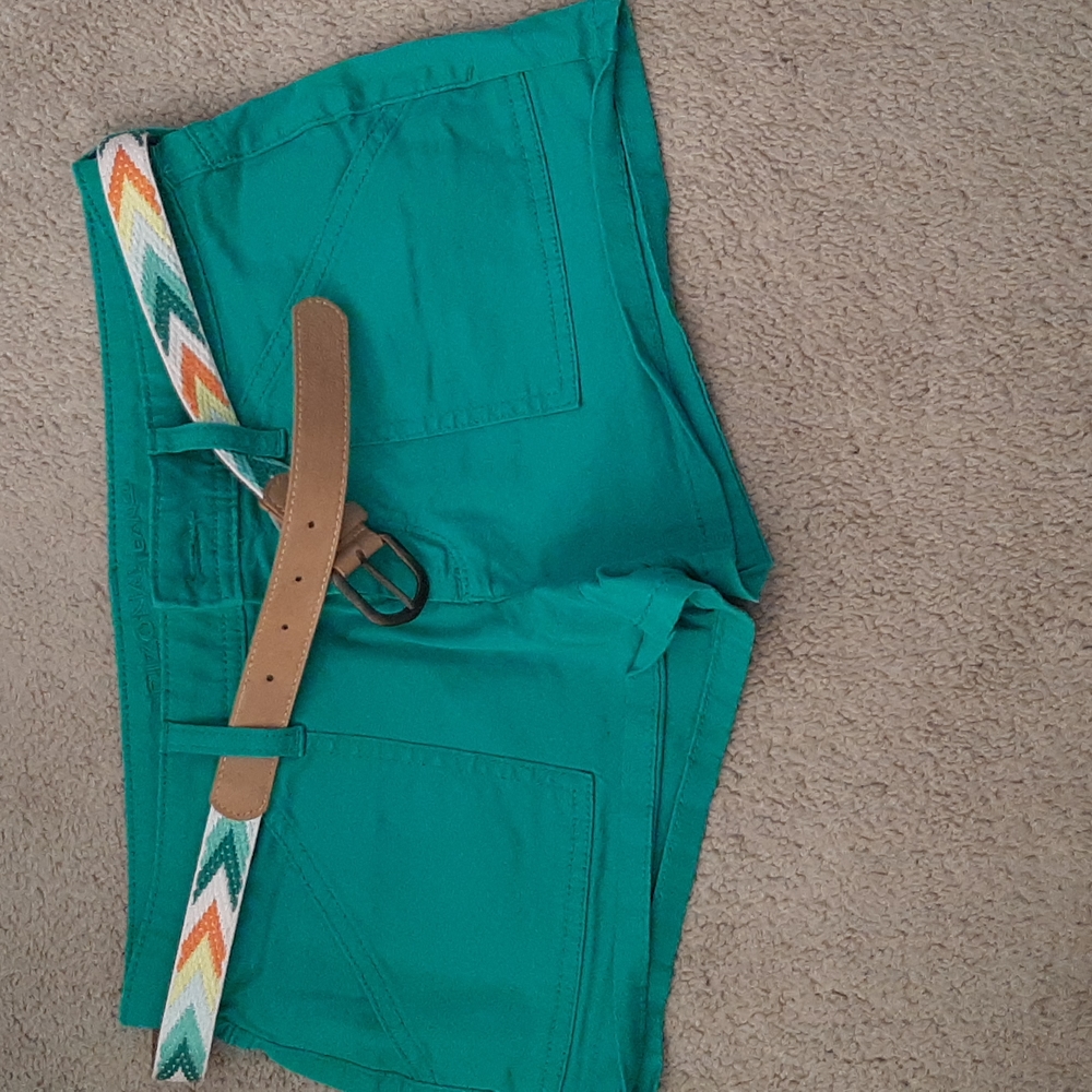 Teal colored shorts with belt.